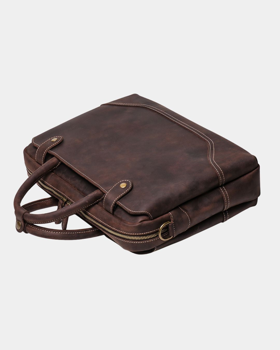 A dark brown distressed leather briefcase with dual top handles, a zippered main compartment, and a side slip pocket, shown on a light gray background.