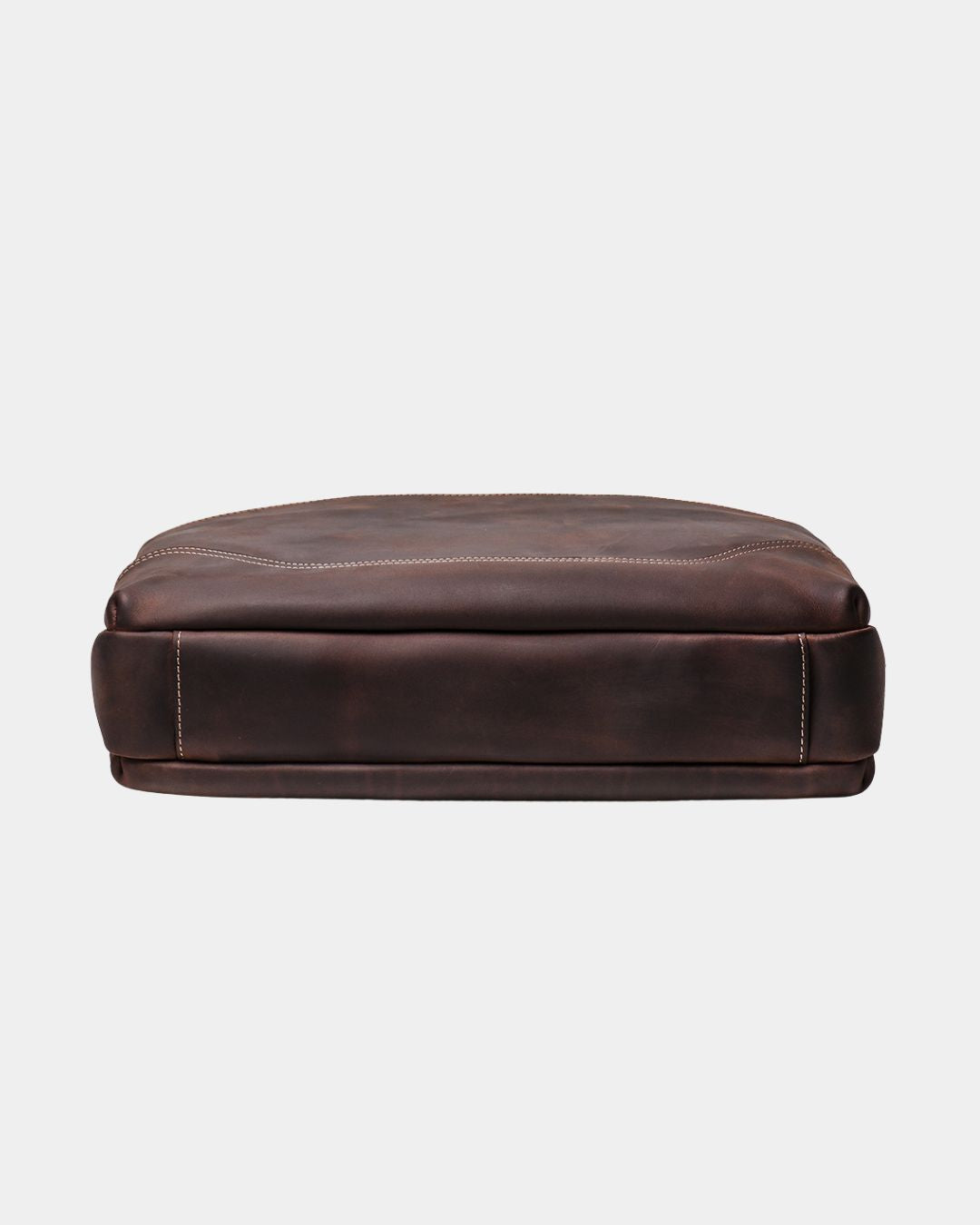 A dark brown leather seat cushion or low bench, shown from a front-facing perspective against a light gray background.