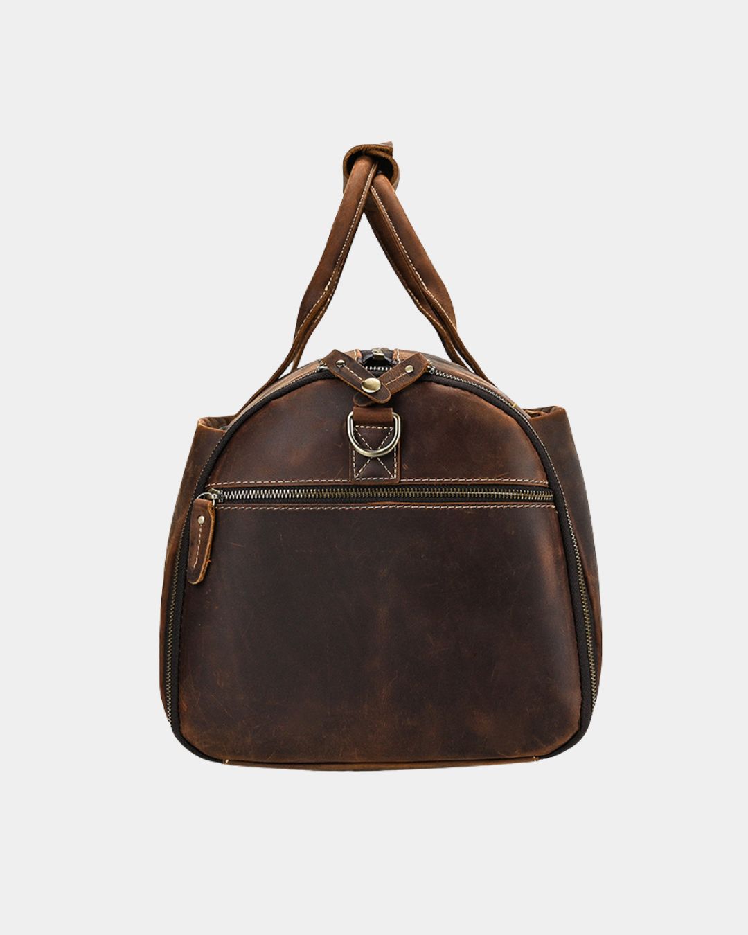 Brown Crazy Horse leather travel duffel bag with a structured design, reinforced handles, and side zipper compartments.