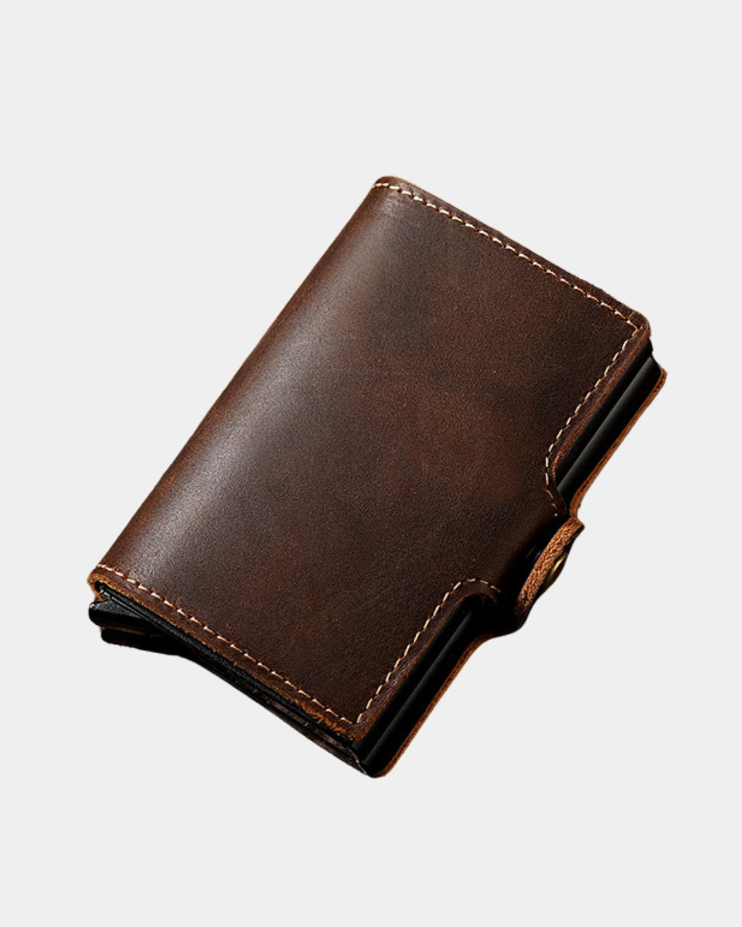 Compact brown genuine cowhide leather pop-up card wallet with a secure snap-button closure and refined stitching.