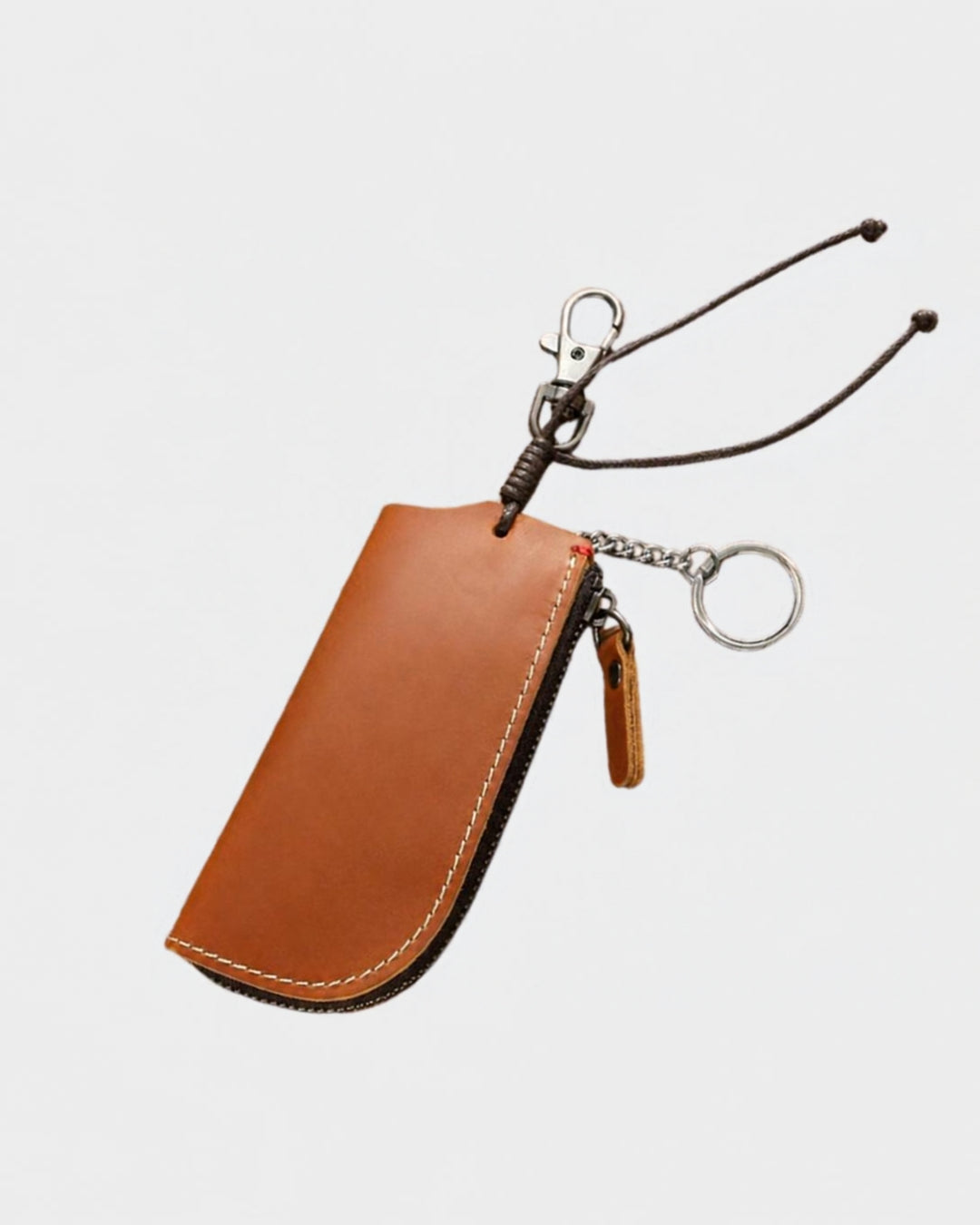 Compact cognac genuine leather key wallet with a metal zipper, key ring, and a sturdy clip for belt loop attachment.