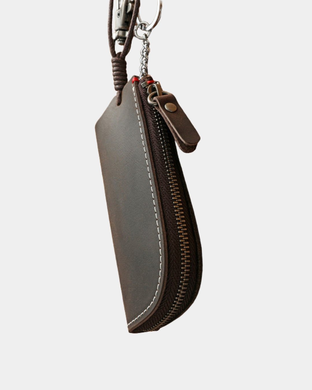 Compact brown genuine cowhide leather key wallet with a secure zipper, metal key ring, and clip for easy attachment.
