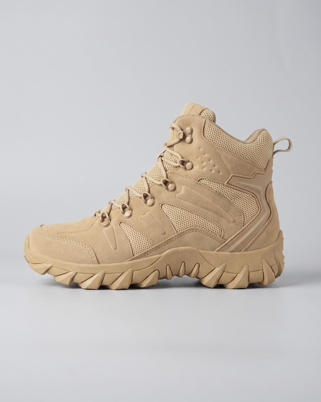 Mens hiking tactical combat boot in a beige color, shown from the side by Hudson & Tate.