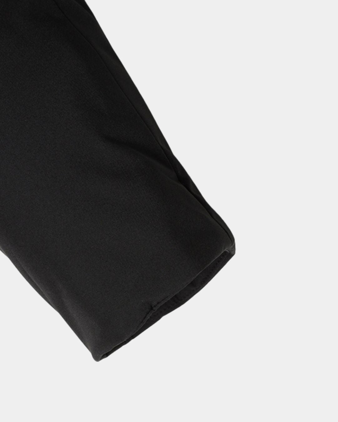 Close-up of a black padded winter parka sleeve with a clean, streamlined design and smooth fabric finish.