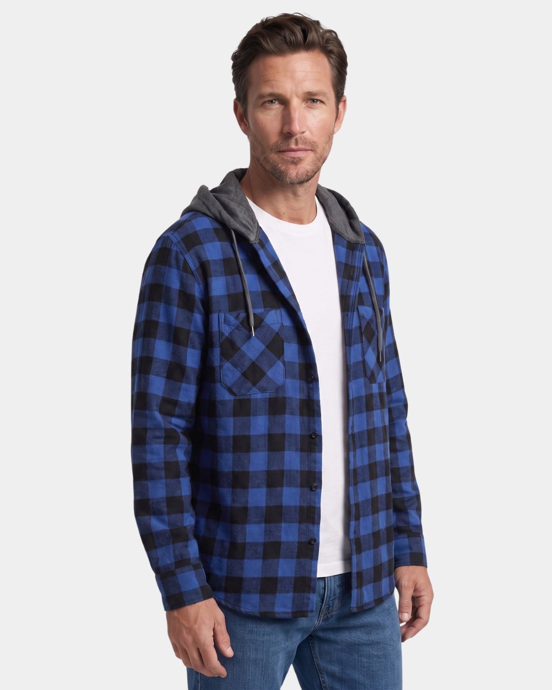 Man wearing a blue and black plaid flannel shirt with a grey drawstring hood, button-front, and dual chest pockets.