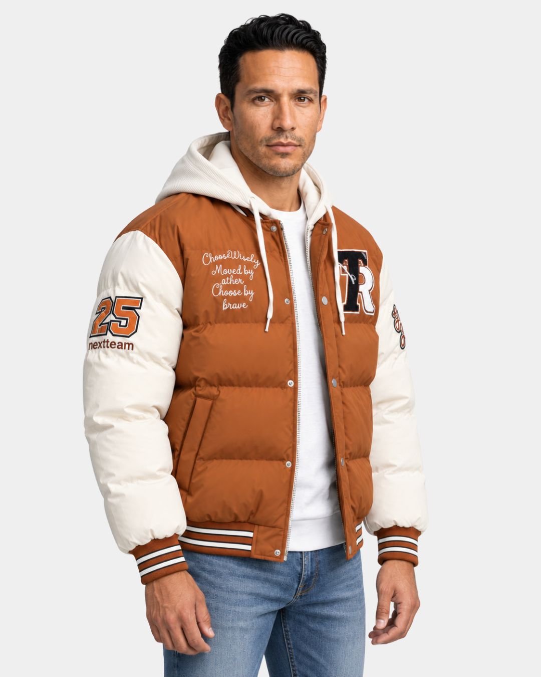 Men’s brown and cream hooded varsity puffer jacket with embroidered patches, full-zip front, and striped ribbed trim.