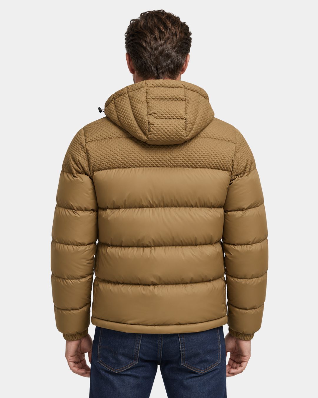 Back view of a tan men’s insulated puffer jacket with a textured hood and upper panel, worn with blue jeans.