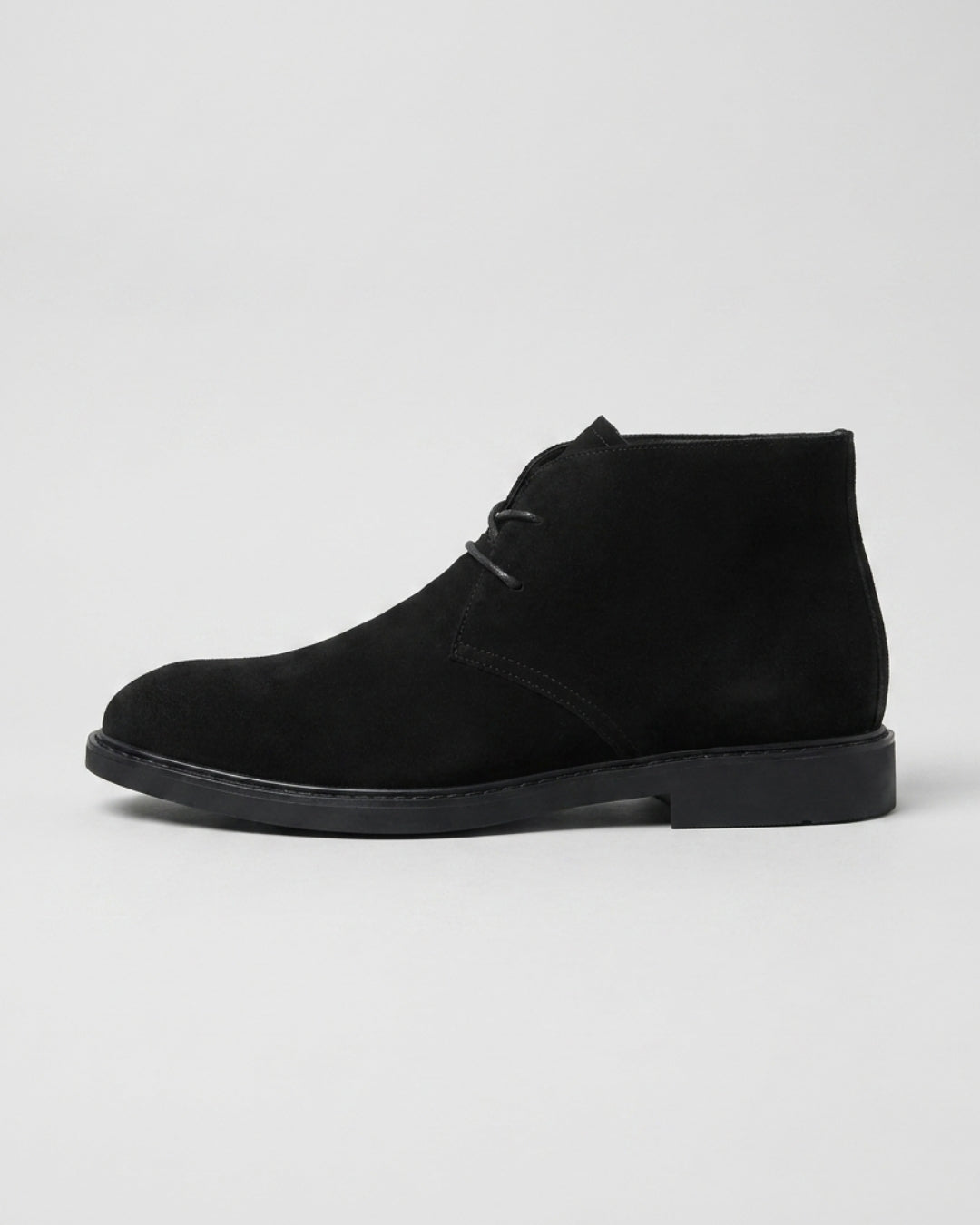 Men’s black suede chukka boots featuring a two-eyelet lace-up design, square toe, and a durable low-profile rubber sole.