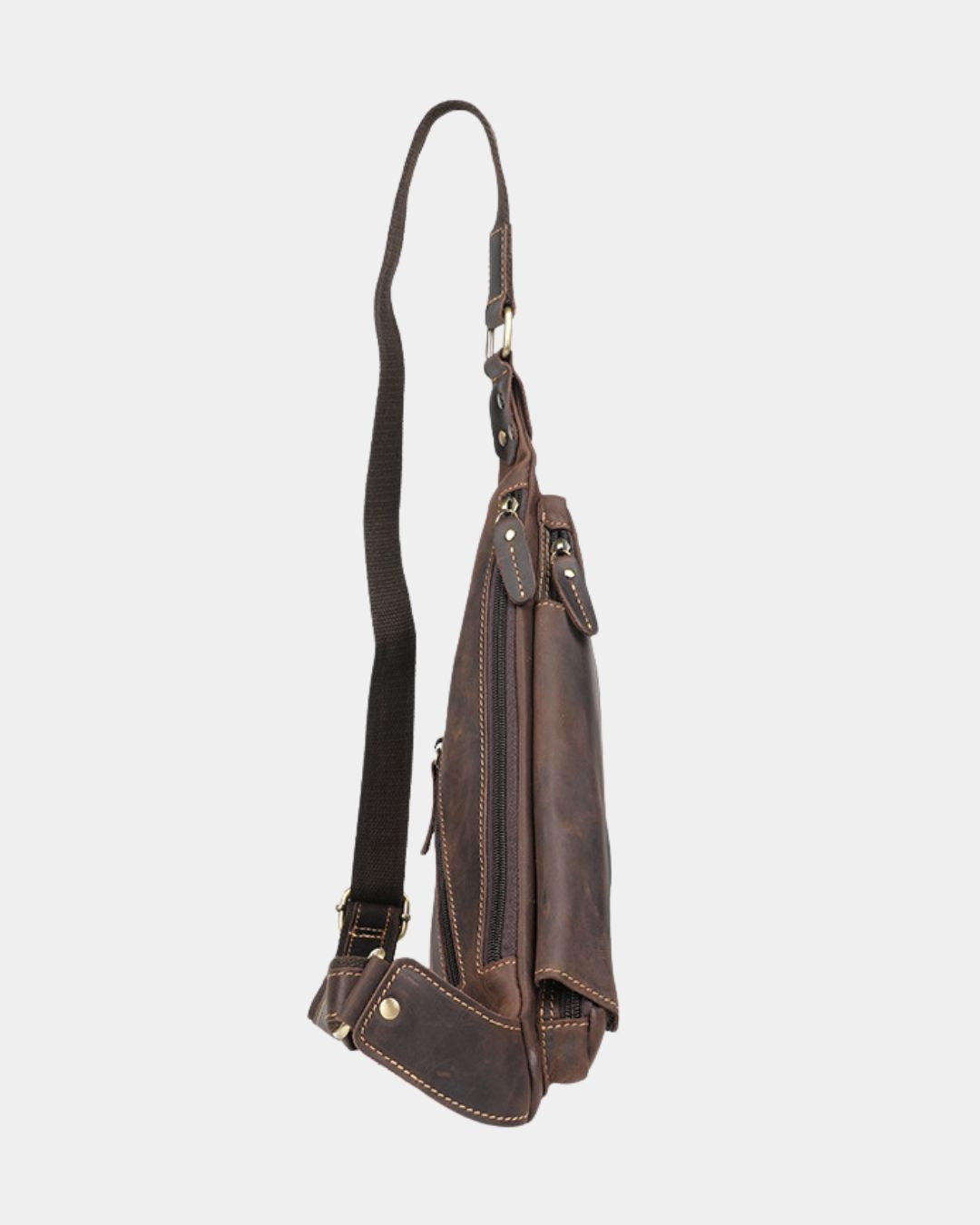 Compact brown genuine leather crossbody sling bag with a vintage finish, secure zip pockets, and an adjustable shoulder strap.
