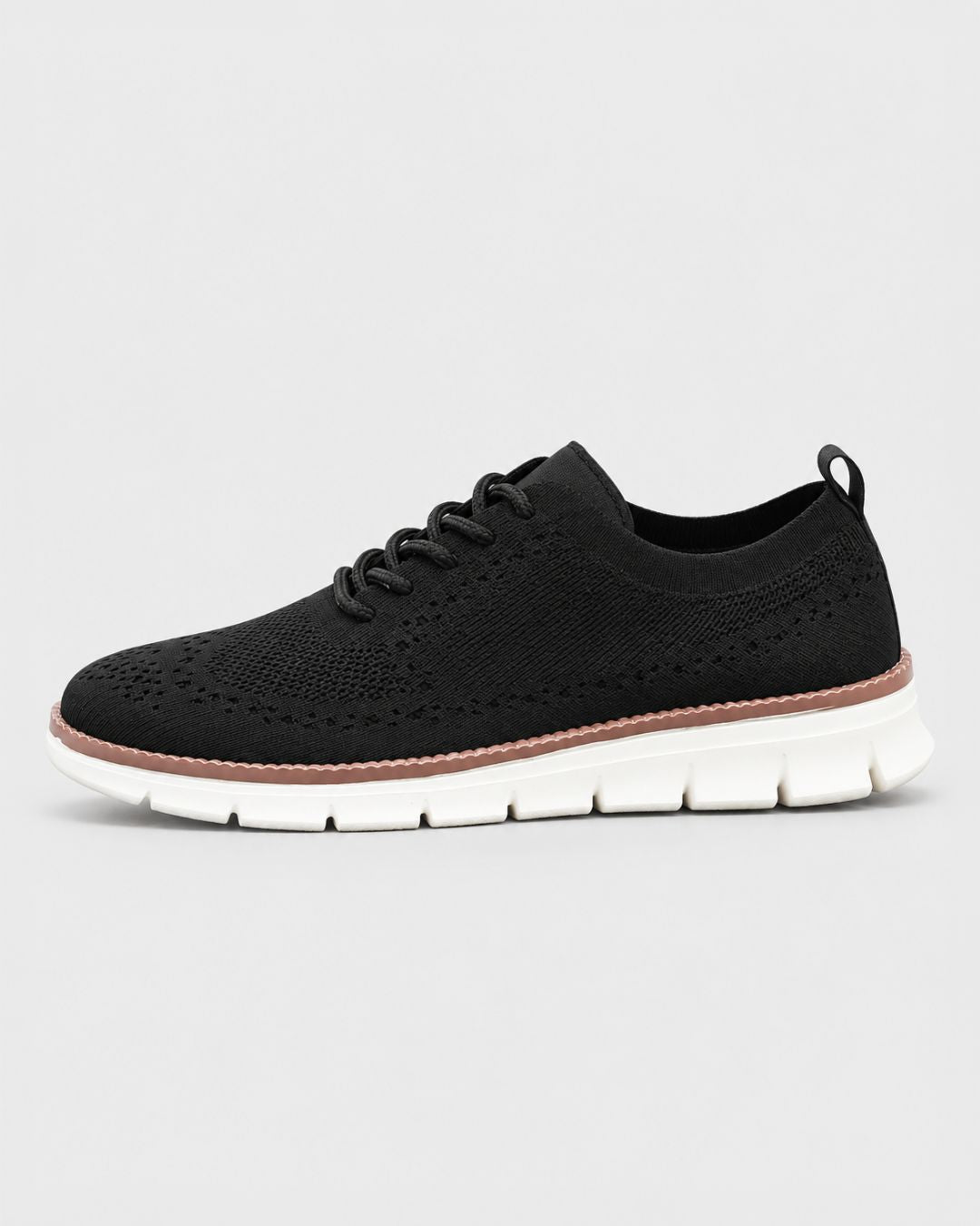 Black lightweight men’s dress sneaker with breathable mesh upper, lace-up closure, and a cushioned white EVA sole.