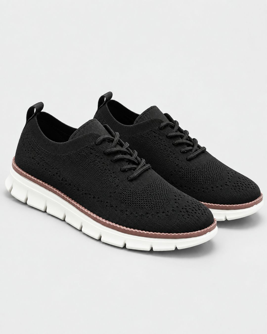 Men’s black breathable mesh dress sneakers with lace-up closure and a comfortable white cushioned EVA sole.