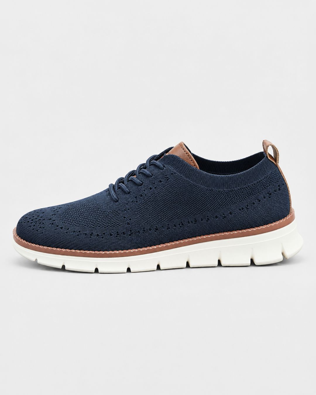 Navy blue breathable mesh dress sneaker with brown leather accents and a white cushioned EVA sole.