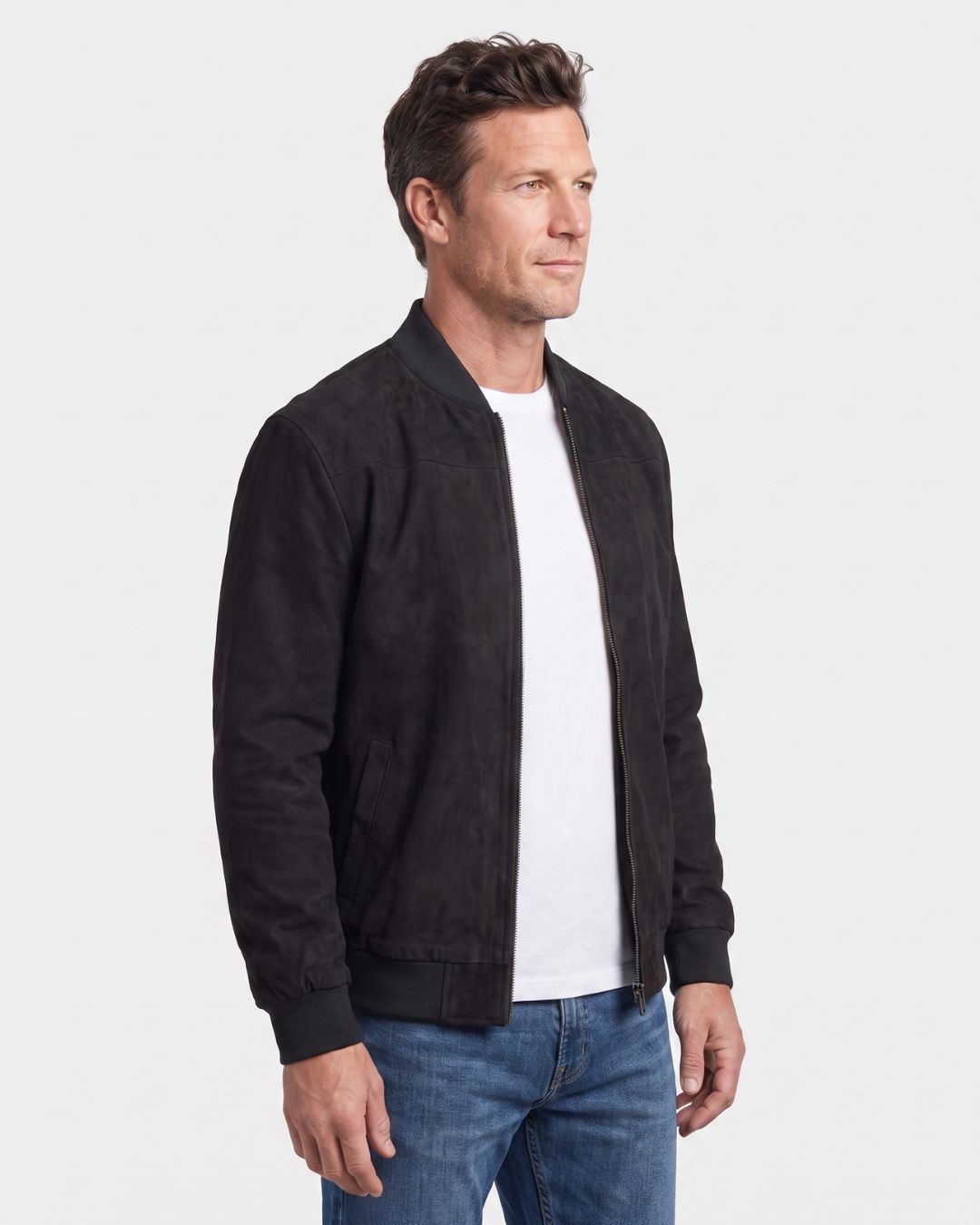 Man wearing a black lightweight fleece bomber jacket with a suede-like finish, stand collar, and full-zip front.