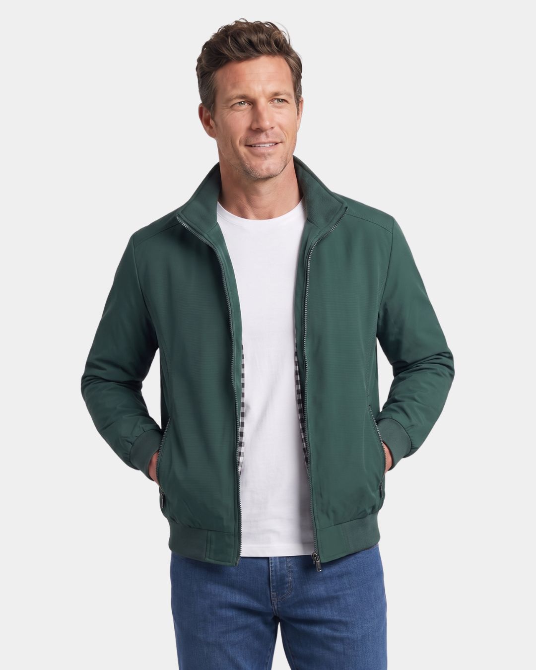 Green lightweight Harrington jacket with a stand collar, full-zip front, and ribbed cuffs worn over a white T-shirt.
