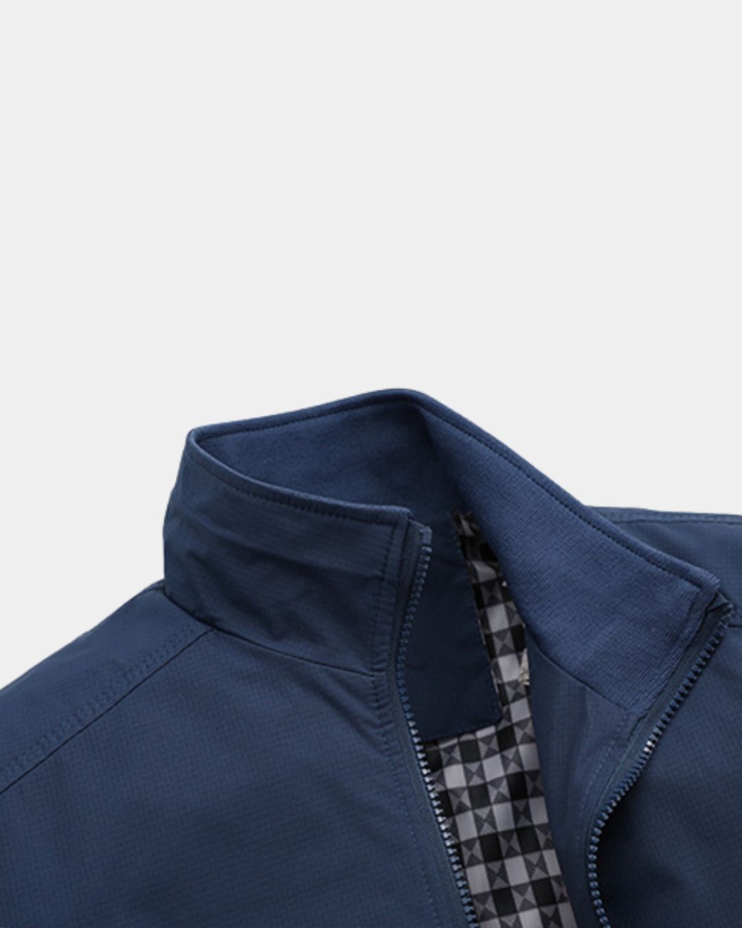Navy blue lightweight Harrington jacket with a stand collar, full-zip front, and a classic checked inner lining.