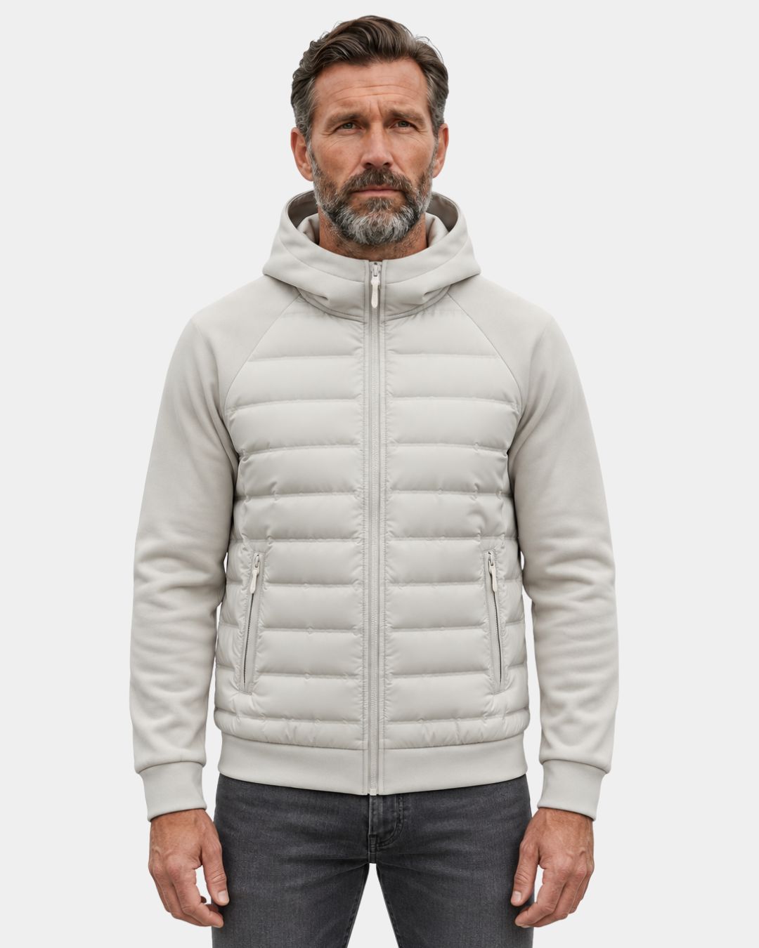 Light grey hybrid puffer jacket with a quilted down body, soft knit sleeves, hood, and zip pockets.