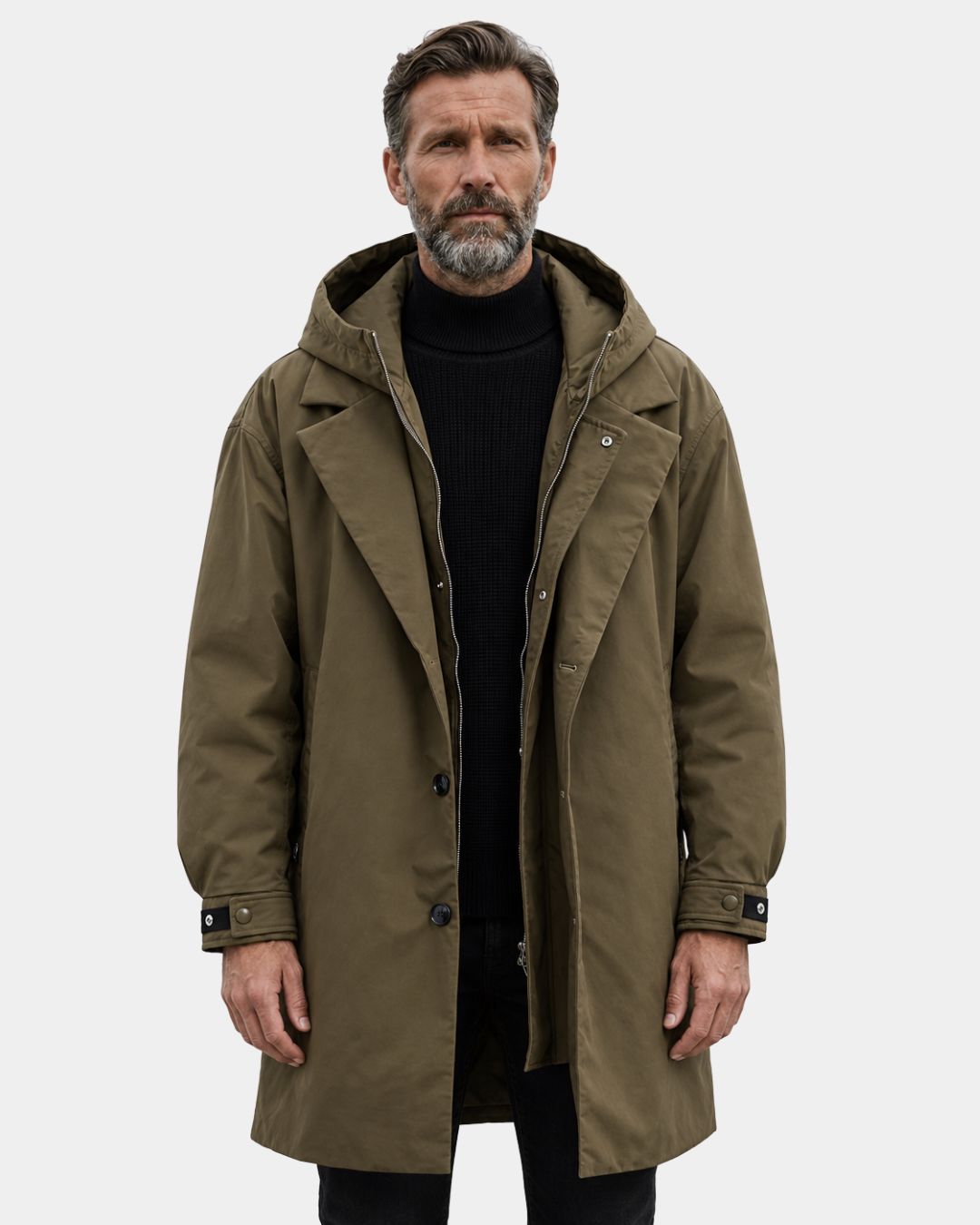 Olive green long hooded overcoat with a trench-inspired design, full zip, button closure, and adjustable cuffs.