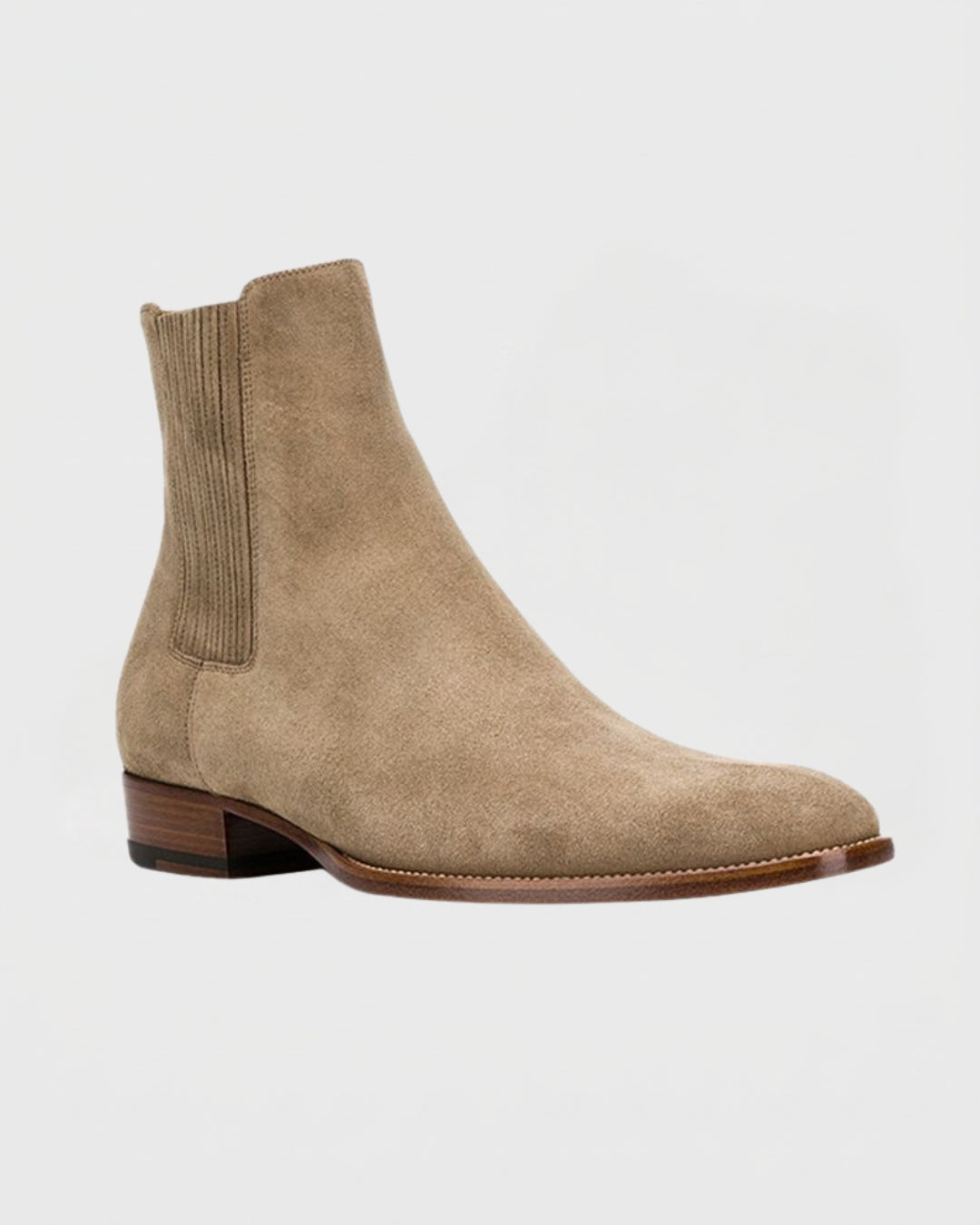 Men’s beige suede Chelsea boots with a pointed toe, elastic side panels, and a low stacked heel.