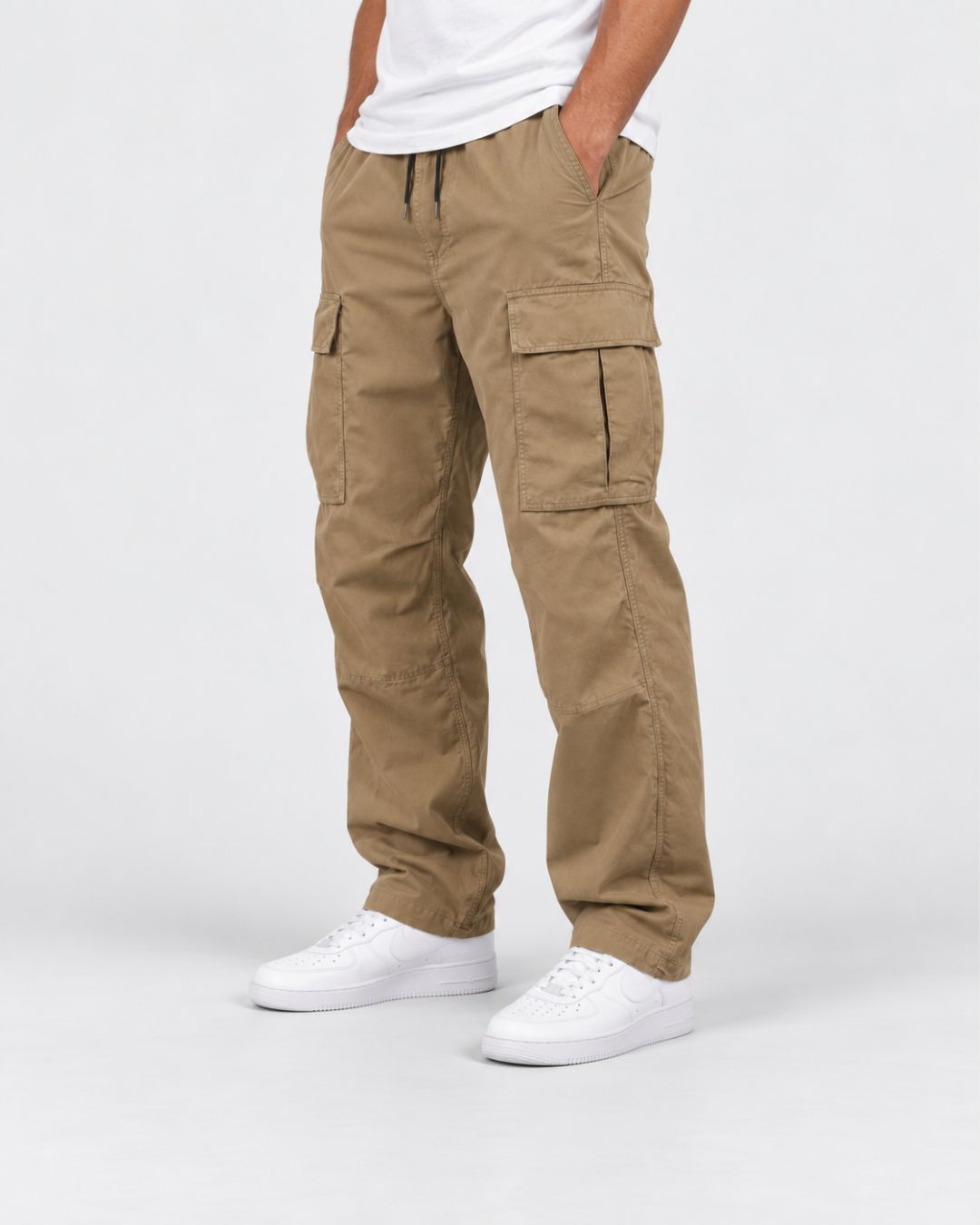 Relaxed fit beige cargo pants with a drawstring waist, large side flap pockets, and straight-leg utility styling.