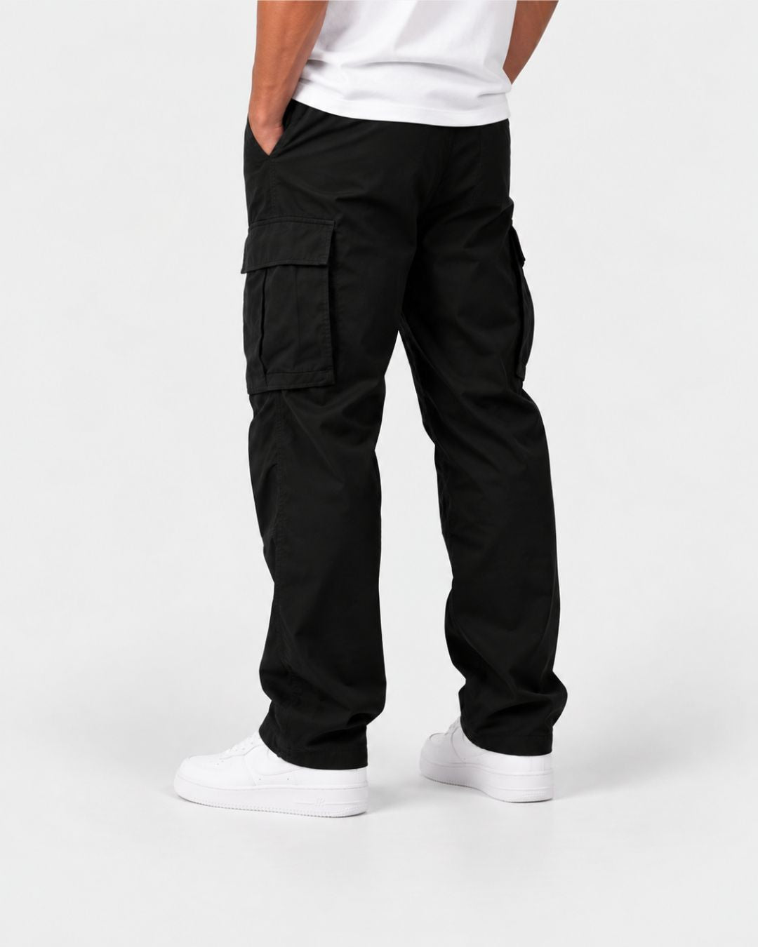 Men’s black relaxed-fit cargo pants with side flap pockets, an elasticated drawstring waist, and adjustable hem cords.