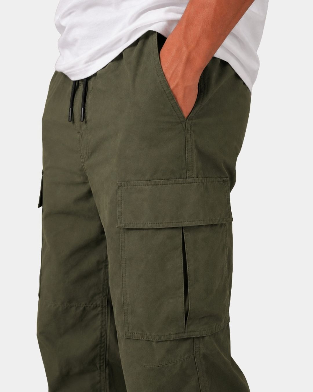 Olive green relaxed-fit cargo pants with an elastic drawstring waistband and large side flap pockets.