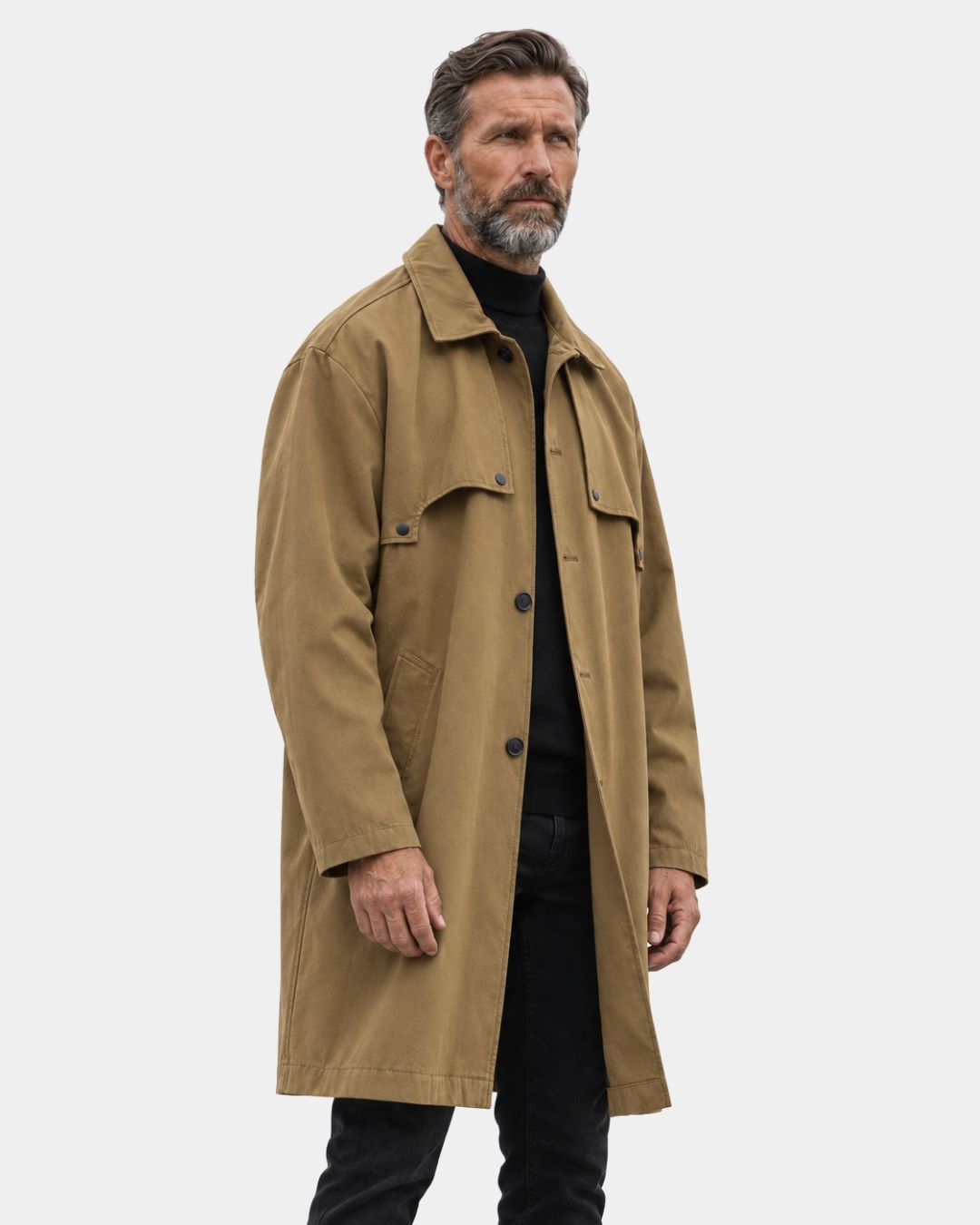 Man wearing a tan, relaxed-fit mid-length trench coat with a lapel collar and single-breasted button closure.