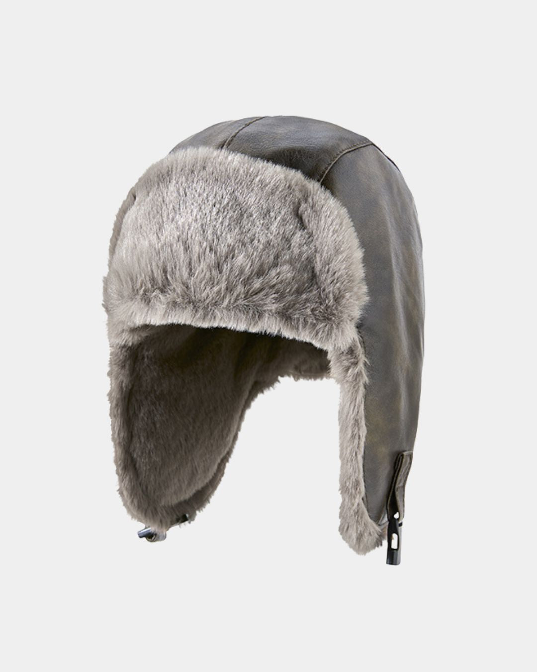Reversible brown leather trapper hat with soft grey fleece lining and adjustable ear flaps for winter weather.