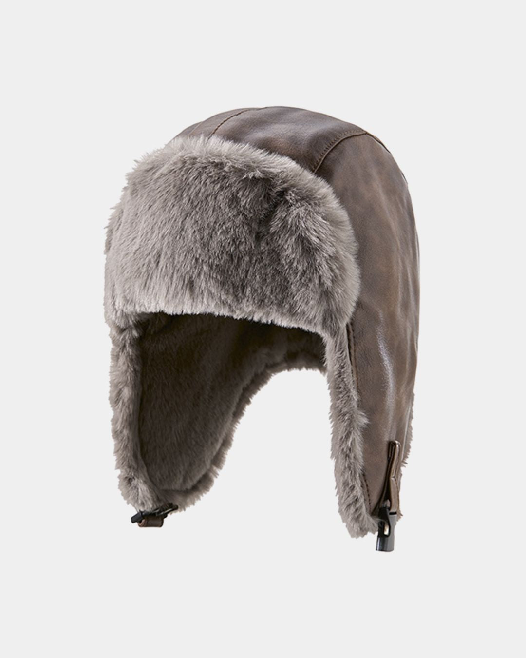 Brown reversible men's trapper hat with a waterproof outer shell and soft grey fleece-lined ear flaps for winter.