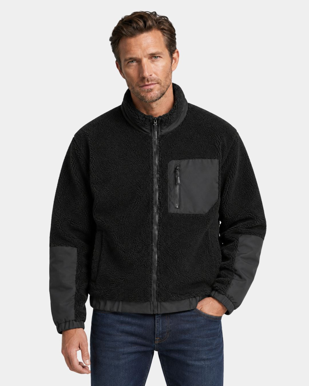 Men’s black sherpa fleece utility jacket with a full-zip front, stand collar, and contrasting chest and forearm panels.
