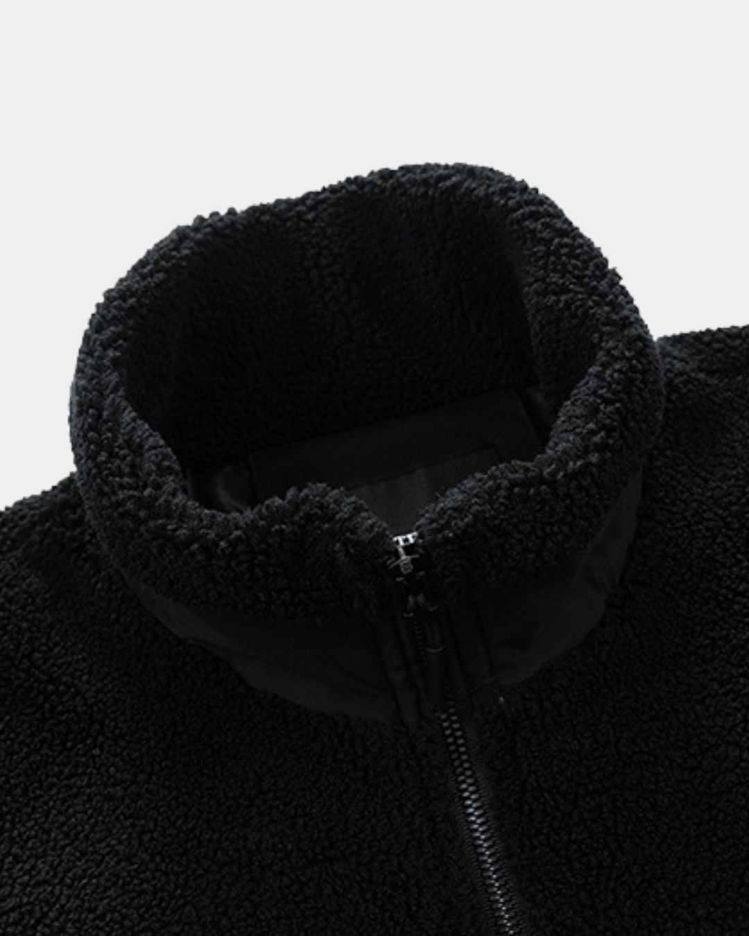 Black men's sherpa fleece utility jacket with a stand collar, full-zip front, and smooth contrast panel detailing.