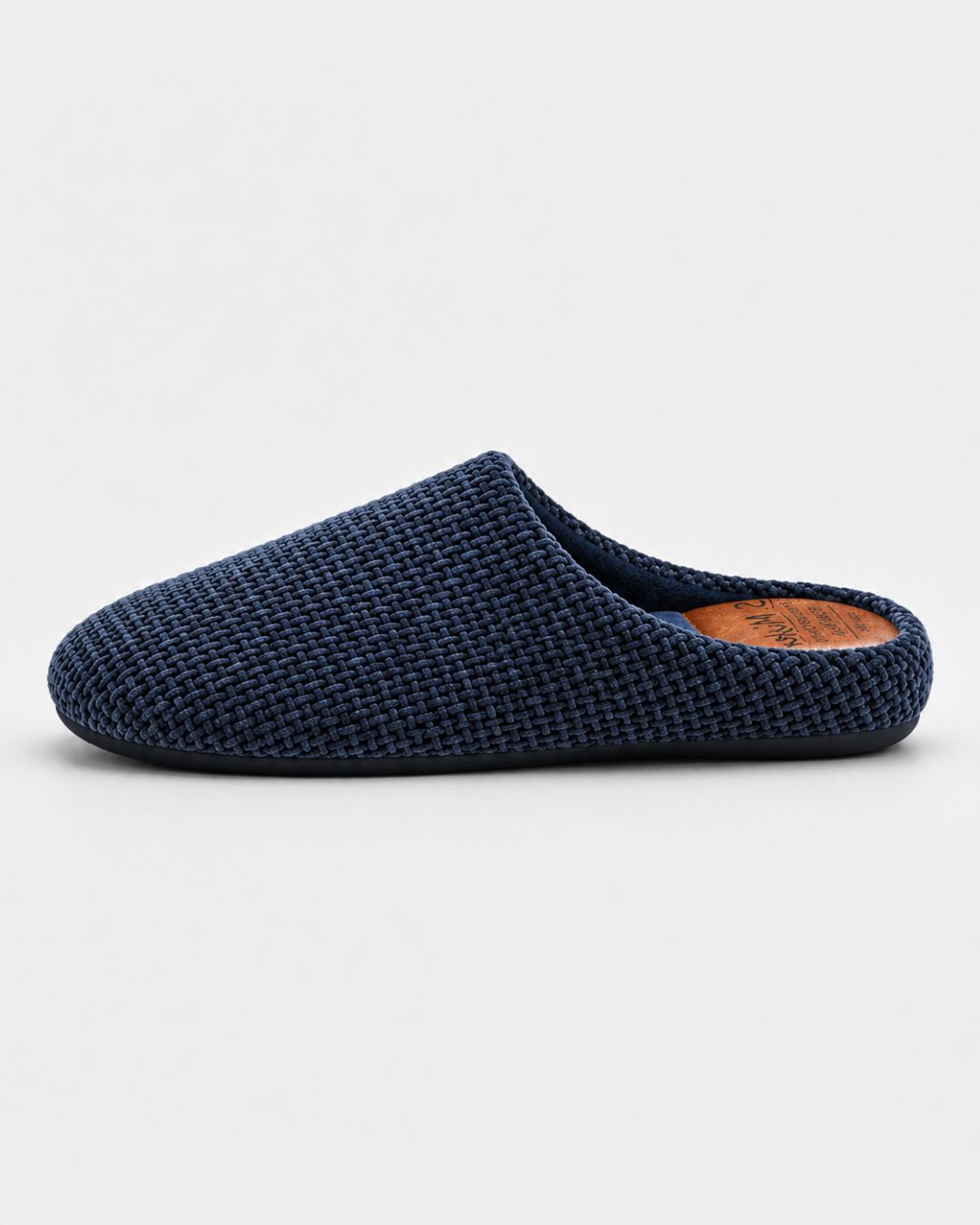 Navy blue men’s slip-on house slippers with a woven textured upper and a comfortable cushioned footbed.