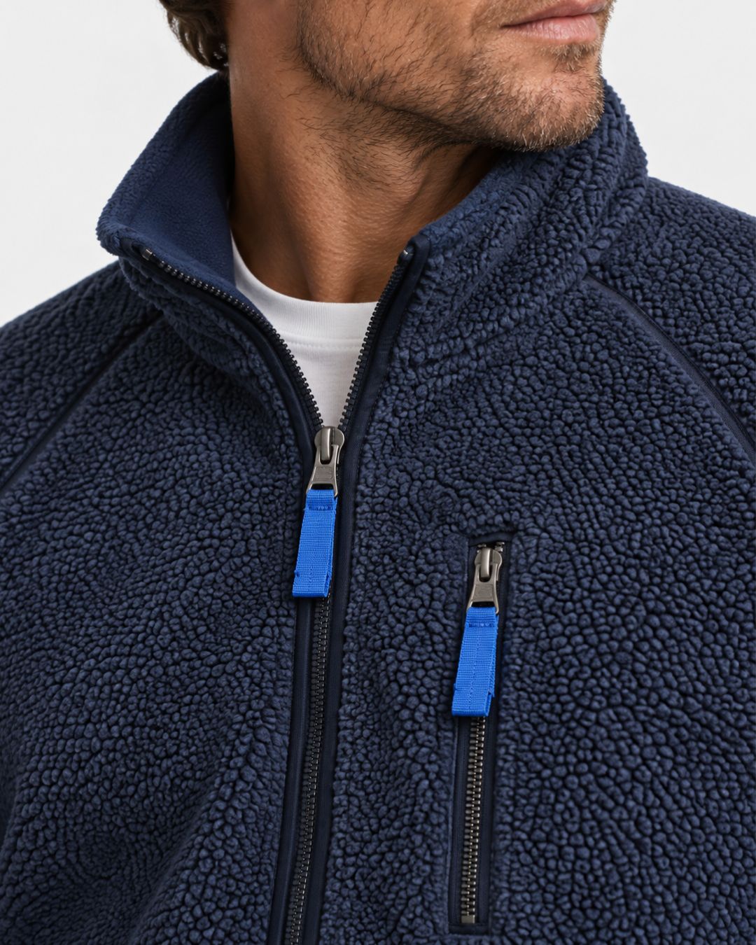 Navy blue men’s teddy sherpa fleece jacket with a stand collar, full-zip front, and a zippered chest pocket.