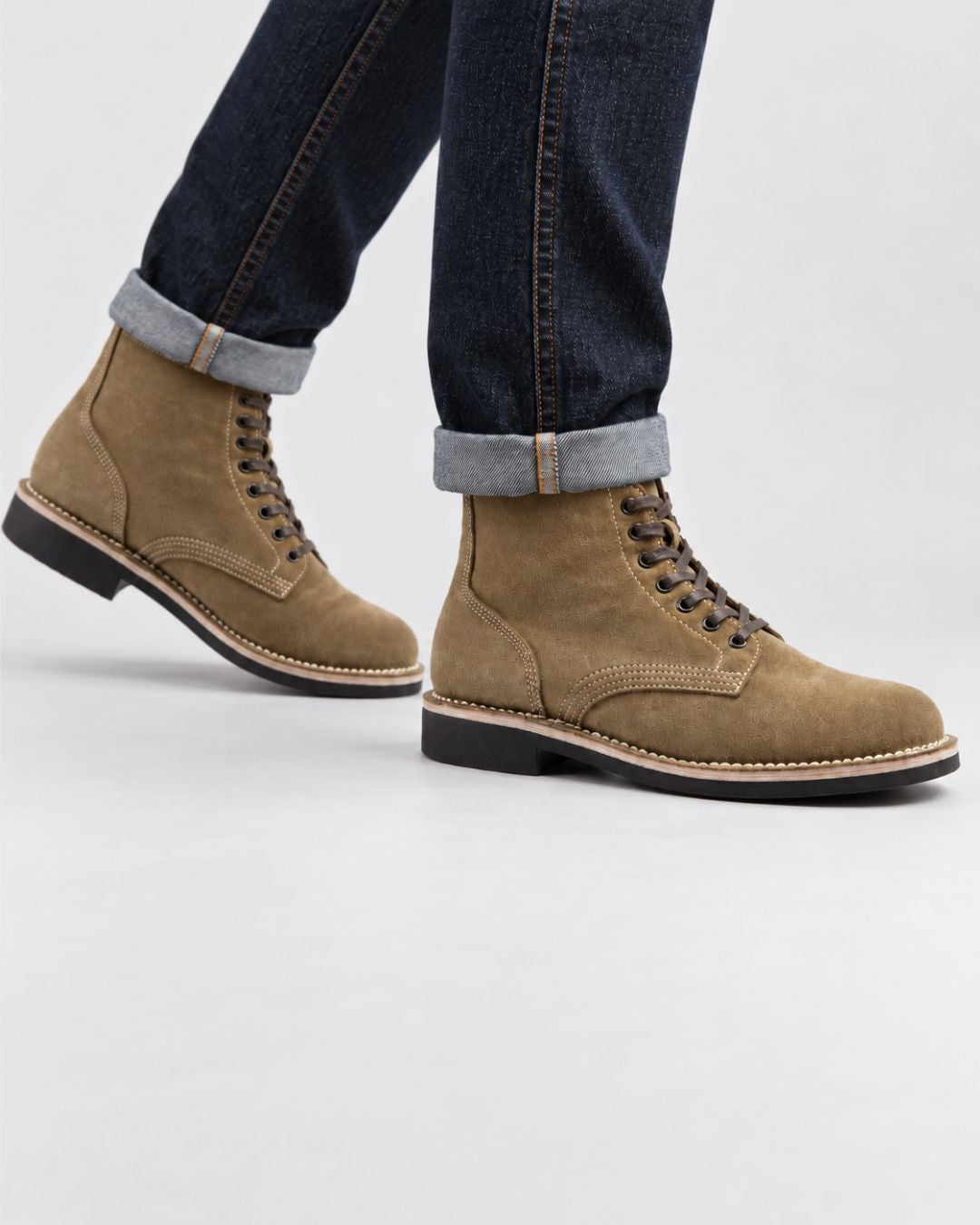 Men’s tan suede lace-up ankle boots with contrast stitching, round toes, and durable black rubber outsoles.