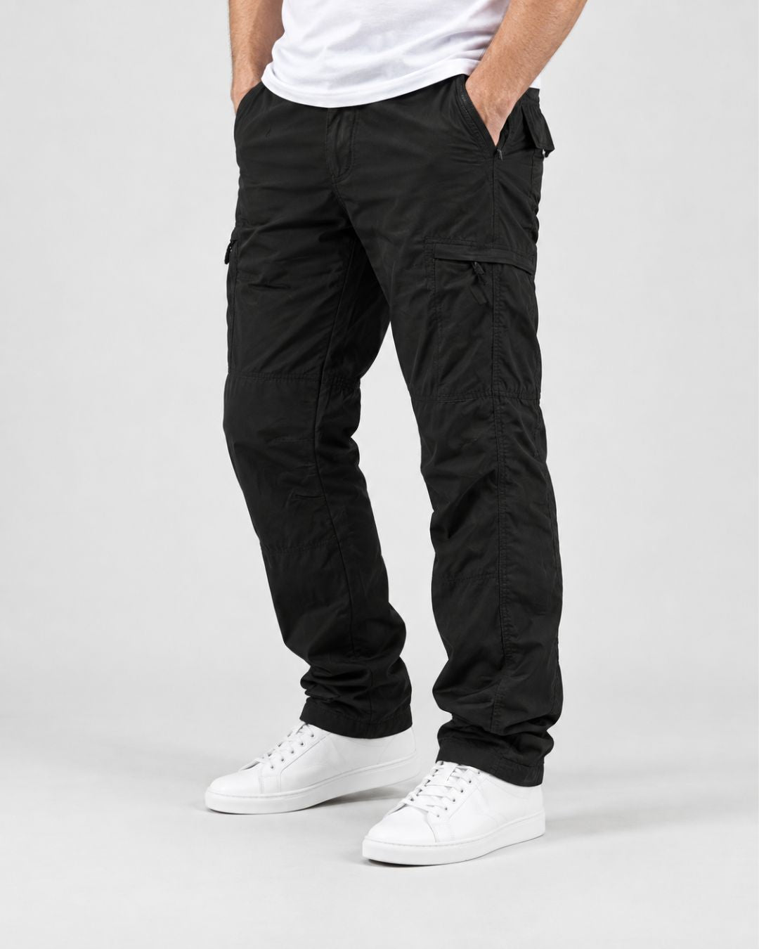 Men’s black fleece-lined cargo pants with a relaxed fit, side zip pockets, and knee seam detailing.