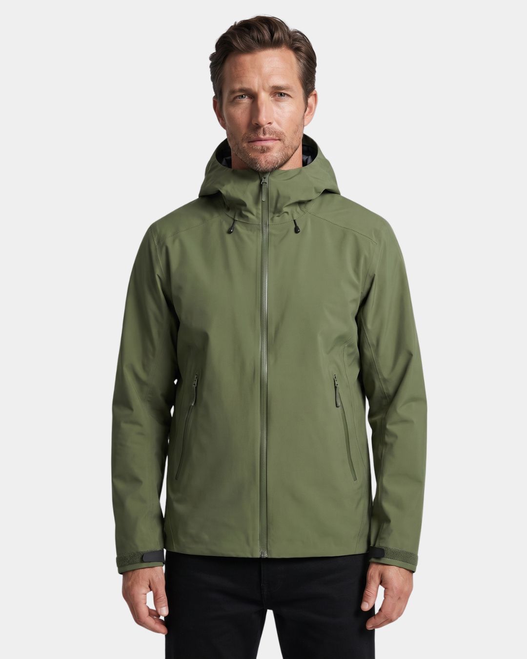 Man wearing an olive green waterproof hooded hiking windbreaker with a full-zip front and adjustable cuffs.