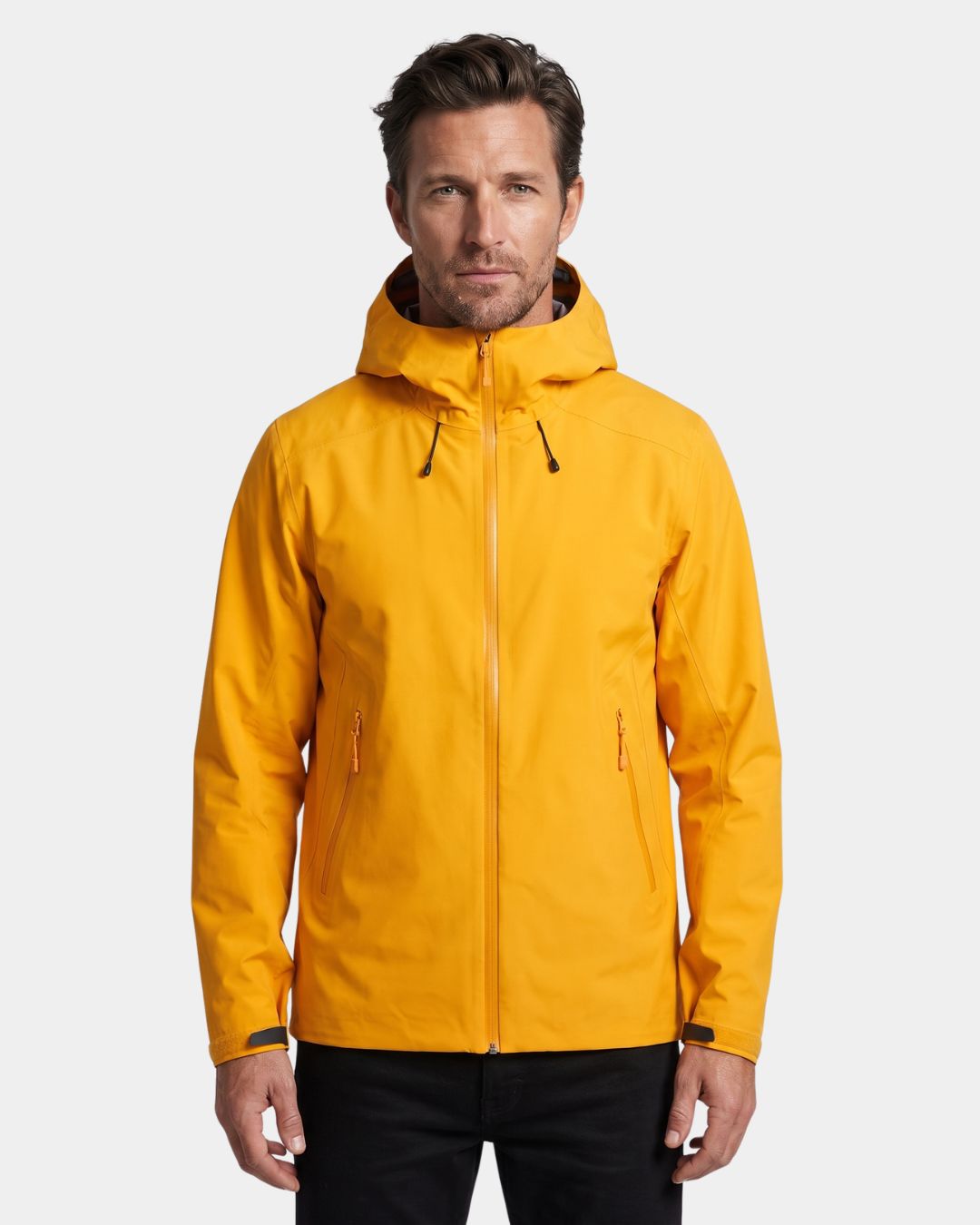 Man wearing a bright yellow waterproof hooded hiking windbreaker with a full-zip front and adjustable features.