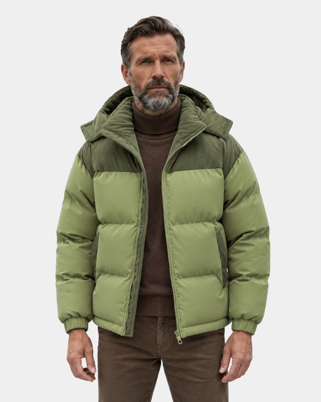 Sage green puffer jacket with corduroy shoulder and hood detailing, featuring a detachable hood and elasticated cuffs.