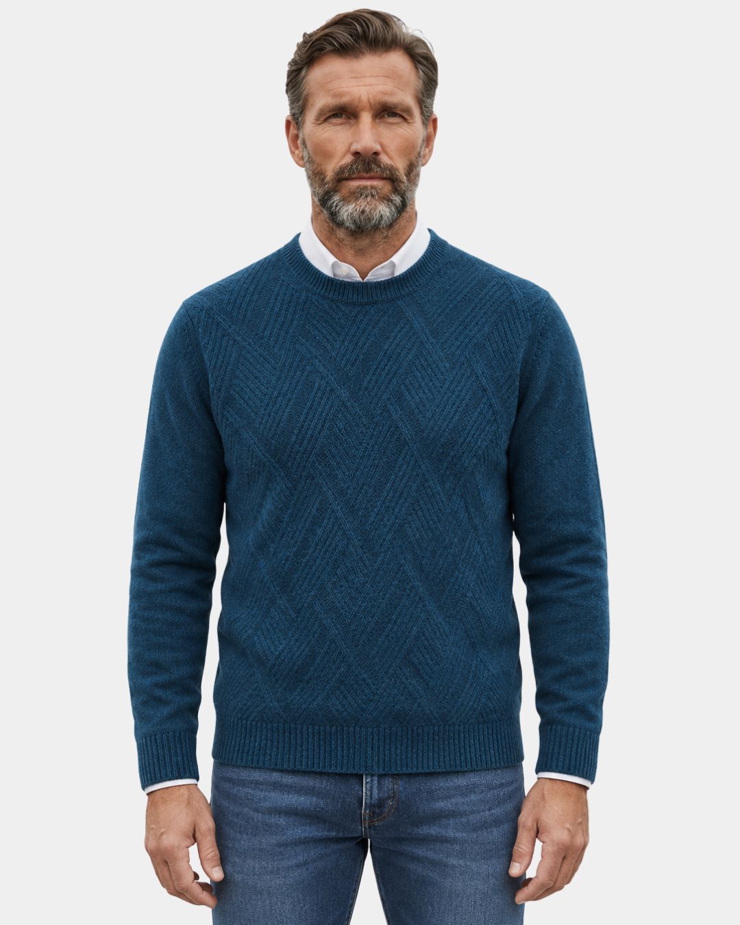 Blue wool crewneck sweater with a raised diamond knit pattern, ribbed trim, and a relaxed fit worn over a white shirt.