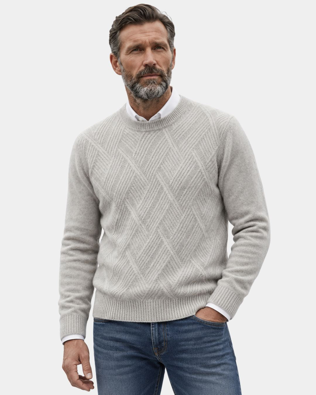 Beige wool crewneck sweater with a raised diamond knit pattern, ribbed trim, and a relaxed fit worn over a white shirt.