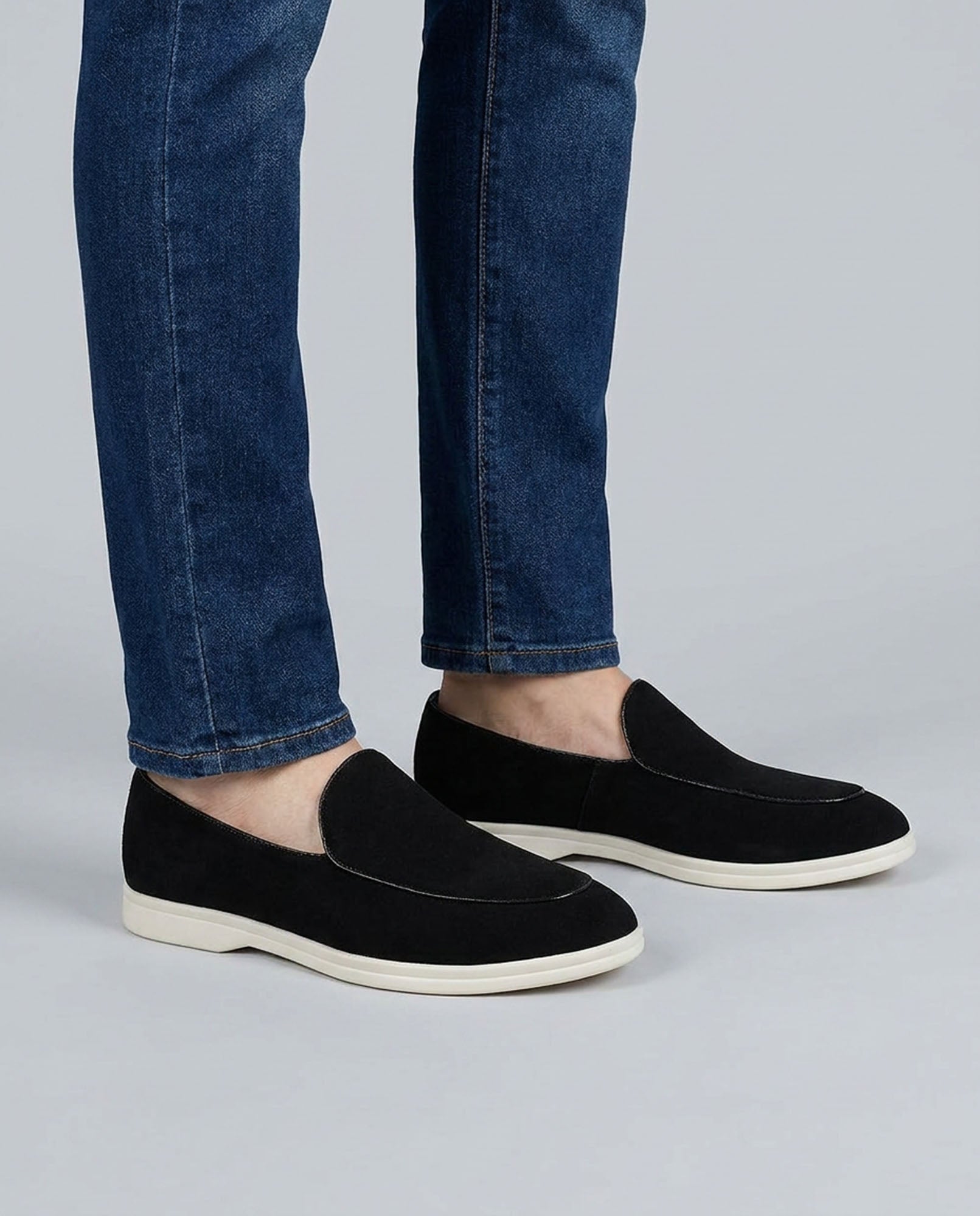 Milan men's black suede slip-on loafers worn with blue denim jeans