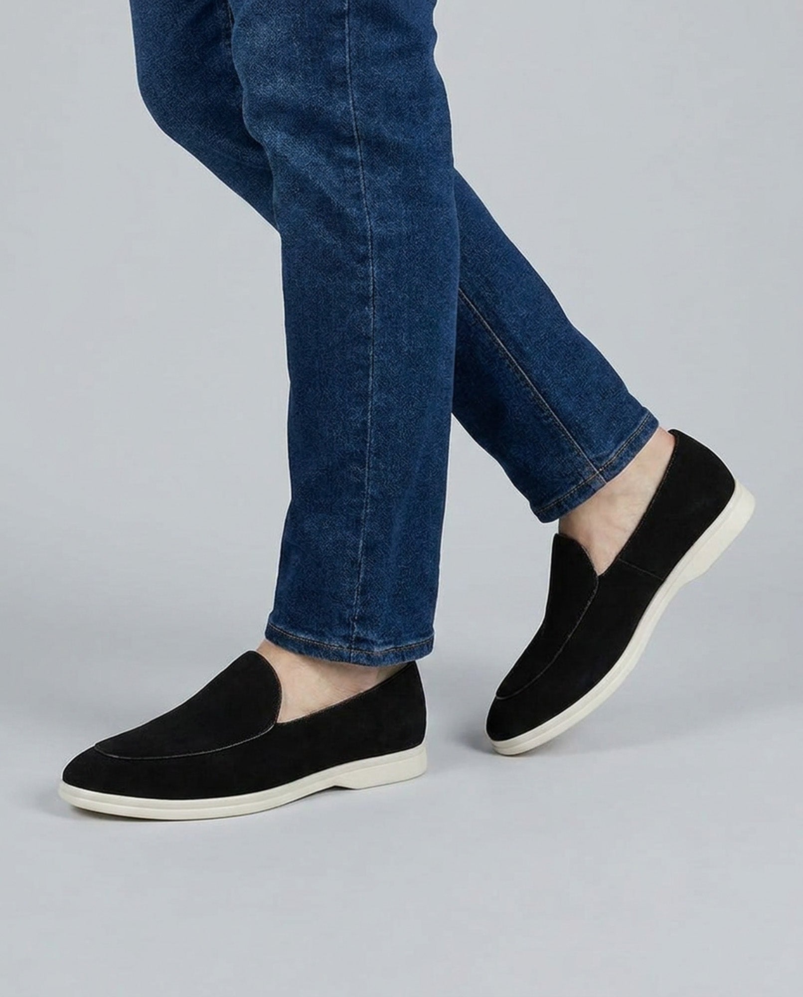 Milan men's black suede slip-on loafers styled while walking