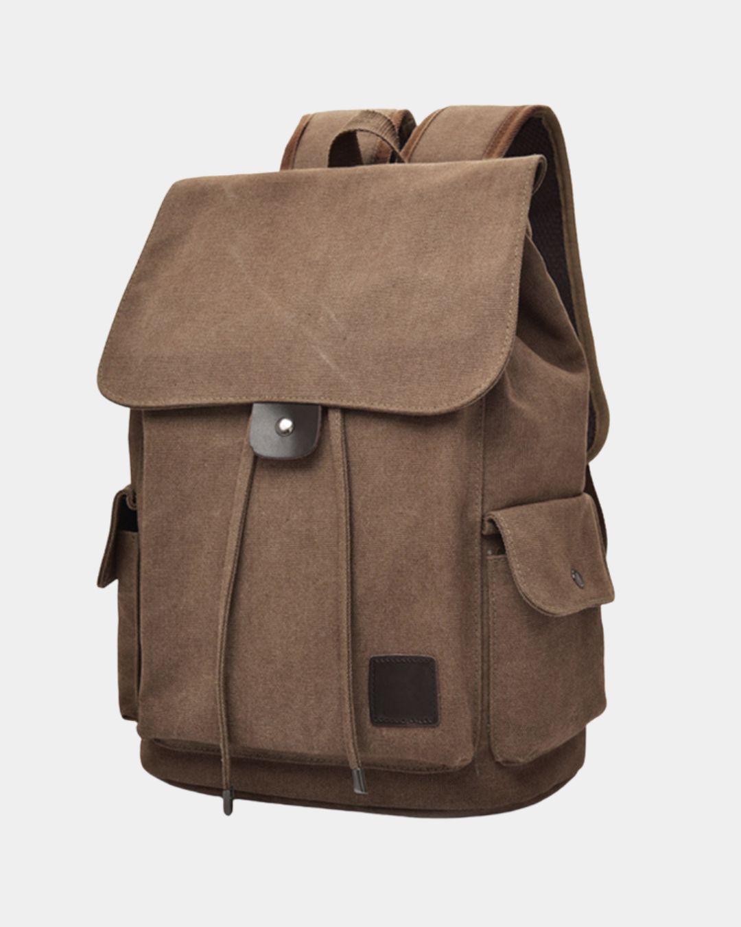 A brown canvas backpack with a large front flap, drawstring closure, side pockets, and a small square patch on the lower front, by Hudson & Tate.