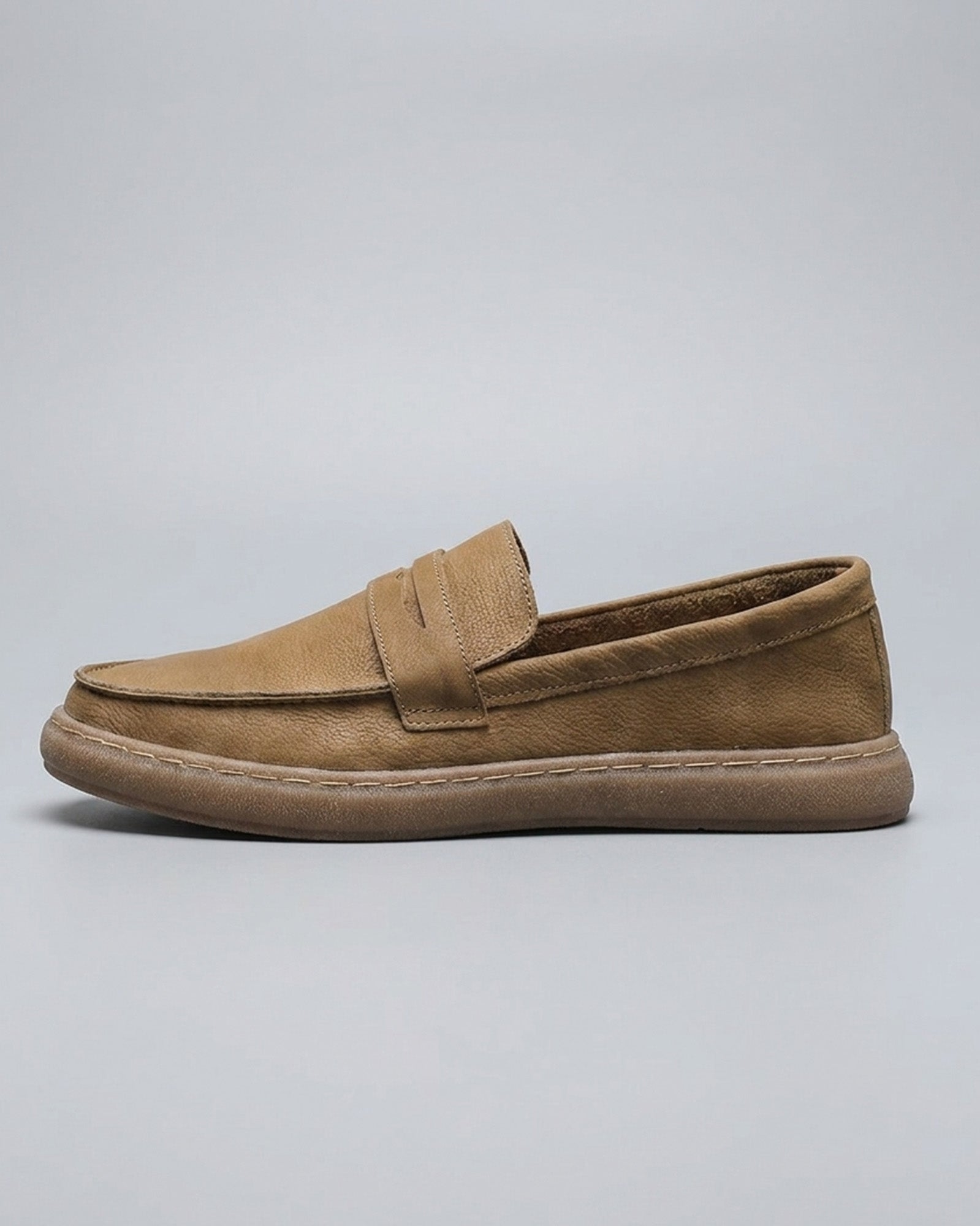 Side view of Salcombe men's beige leather penny loafer with moccasin stitching
