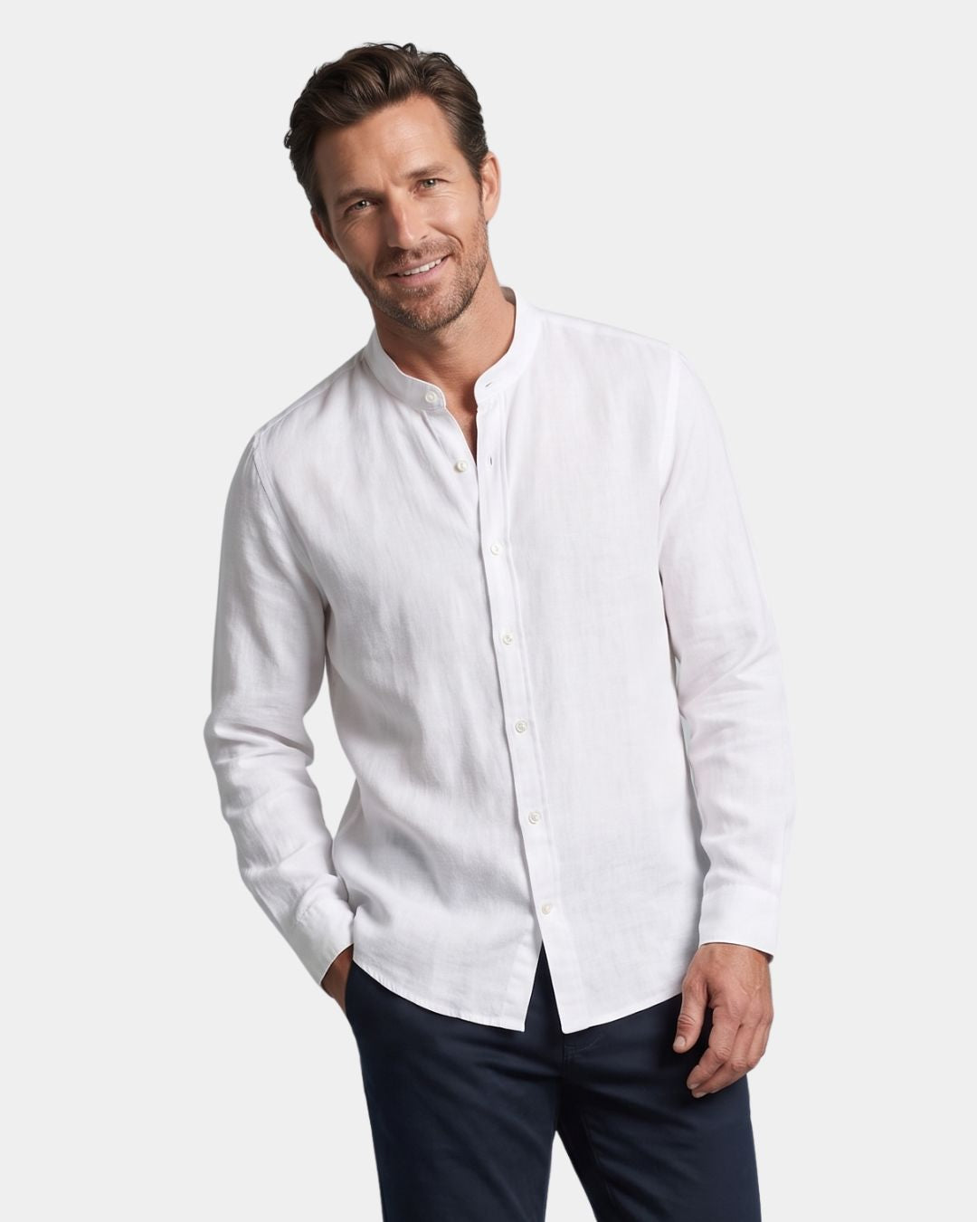 Man wearing a white long-sleeve linen-cotton blend shirt with a stand collar and button-down front.