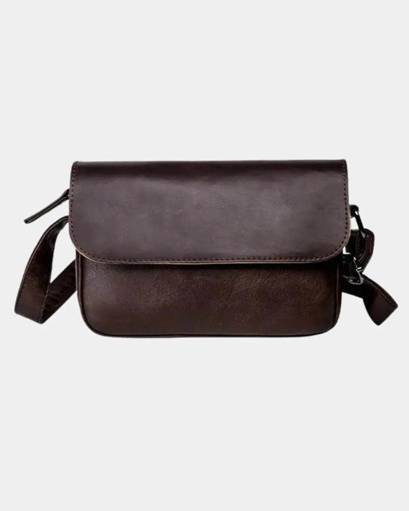 Front view of Torino men's dark brown crossbody bag with structured flap and adjustable shoulder strap