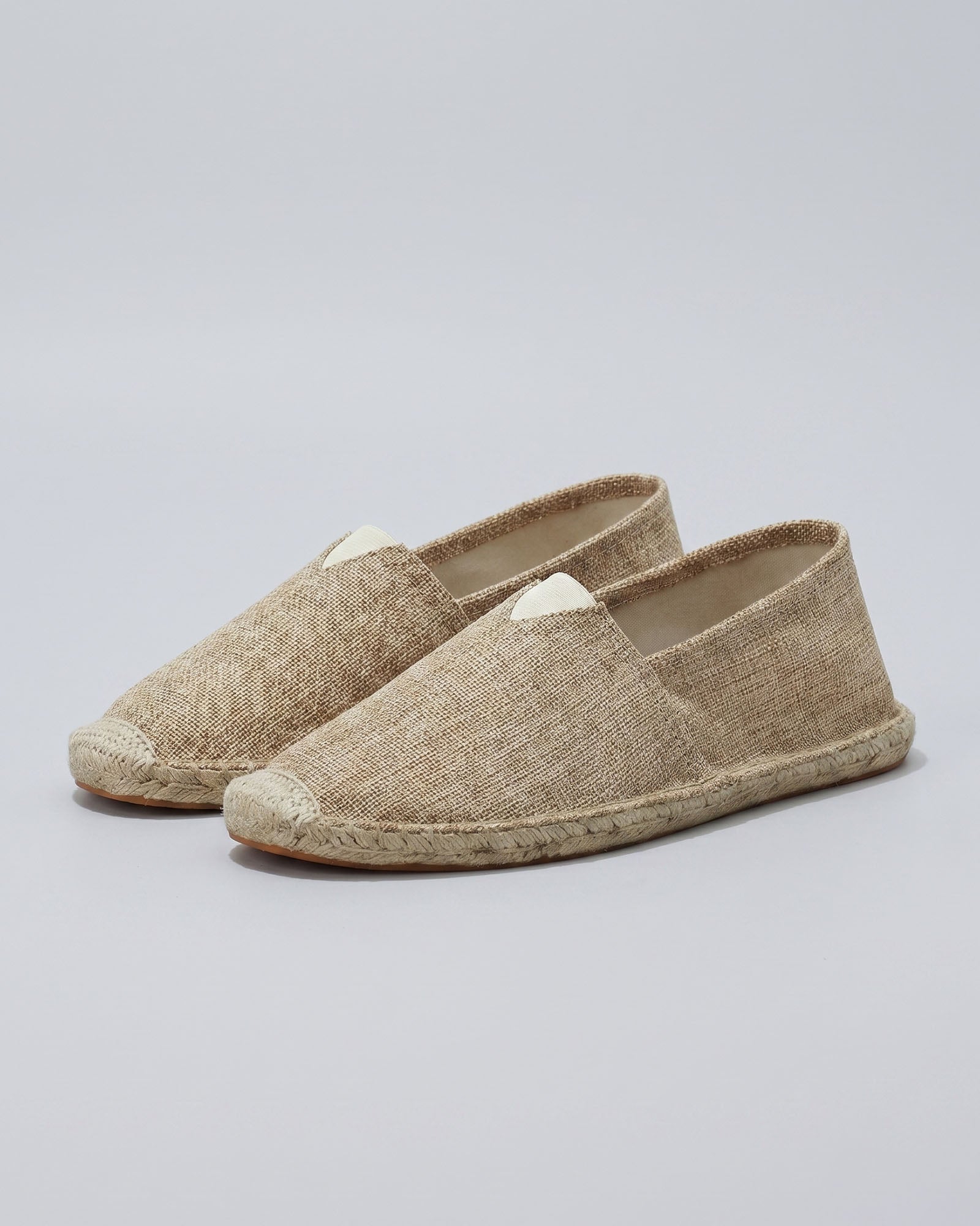 Pair of Tulum men's beige canvas espadrille loafers with woven jute sole