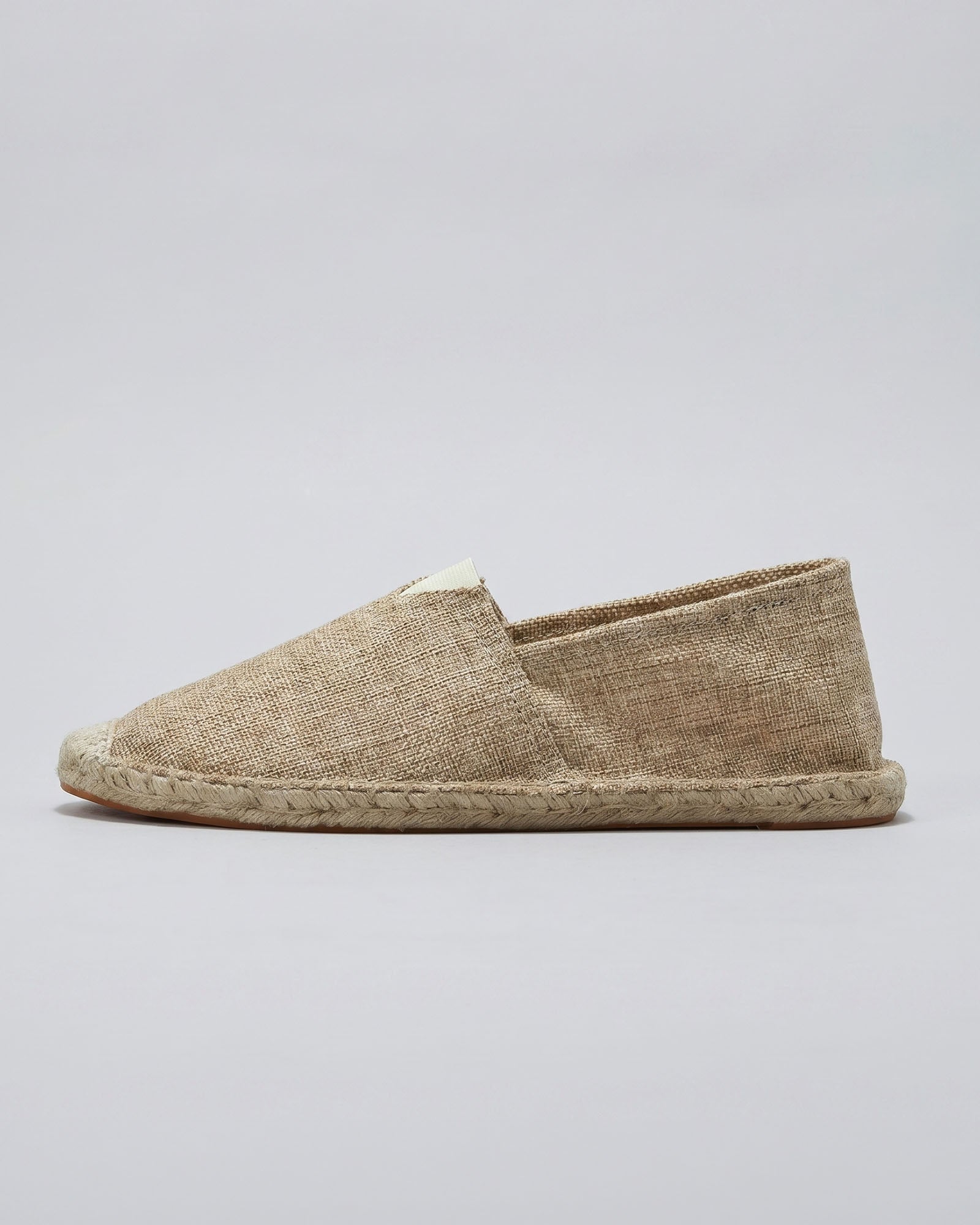 Side view of Tulum men's beige canvas espadrille loafer with woven jute sole