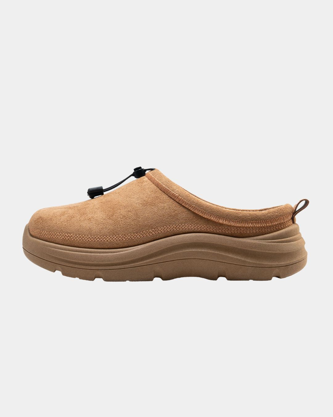 Tan suede indoor-outdoor clog slipper with a thick TPR sole, adjustable toggle closure, and a rear pull loop.